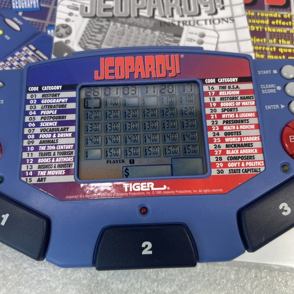 Tiger Electronics Jeopardy Hand Held Game 1995 with‎ Answer Book Tested Read